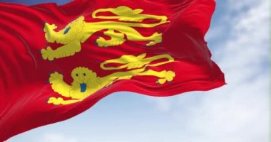 The flag of Normandy region waving in the wind on a clear day. Normandy is the northwesternmost of the eighteen regions of France. Seamless loop in slow motion