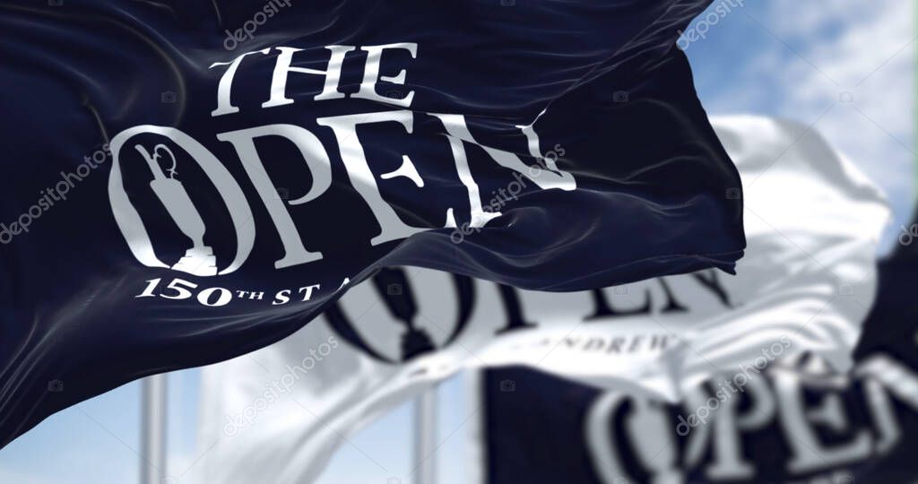 St Andrews, Scotland, June 2022: Three flags with the logo of the 150th The Open Golf Championship are waving in the wind. The Open is a golf tournament to be played in July in St Andrews, Scotland