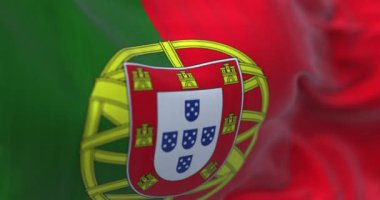 Close-up view of Portugal national flag waving in the wind. Portugal is an European country located in western Europe. Fabric background. Seamless loop in slow motion