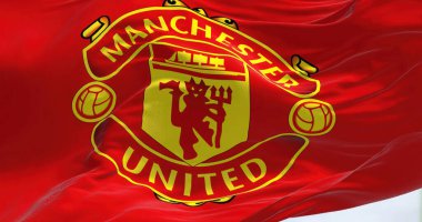 Manchester, UK, May 2022: The flag of Manchester United waving in the wind. Manchester United is a professional football club based in the Old Trafford area of Manchester, England