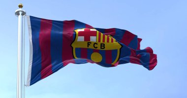 Barcelona, Spain, May 2022: The flag FC Barcelona waving in the wind on a clear day. FC Barcelona is a Spanish professional football club based in Barcelona