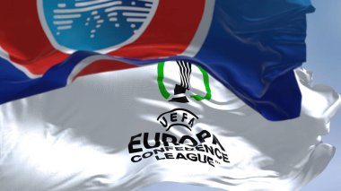 Prague, Czech rep, July 2022: Flags with UEFA and UEFA Europa Conference League waving in the wind. Europa Conference League is an annual football club competition for european clubs