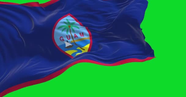 グアムのフラグは 風の中で緑の背景に隔離された手を振る グアムは西太平洋にあるアメリカ合衆国の未編入領域である スローモーションでシームレスなループ クロマキー — ストック動画