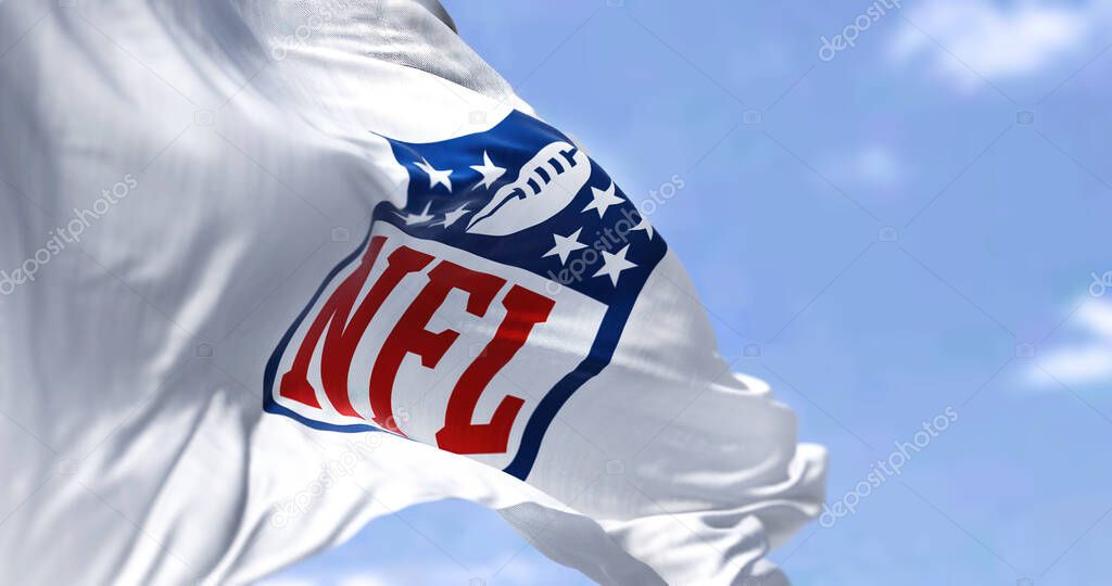 Inglewood, CA, USA, January 2022: The flag with the NFL logo waving in the wind. NFL is a professional American football league