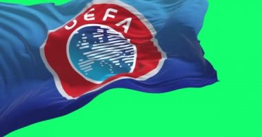 Nyon, CH, Eylül 2022: UEFA bayrağı yeşil arka planda izole bir şekilde dalgalanıyor. Yavaş çekimde kusursuz döngü. Yeşil ekran ve krom tuş
