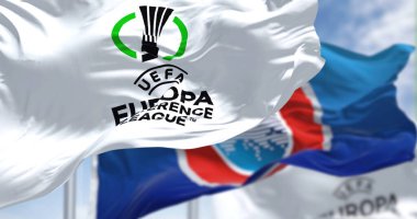 Prague, Czech rep, July 2022: Flags with UEFA and UEFA Europa Conference League waving in the wind. Europa Conference League is an annual football club competition for european clubs