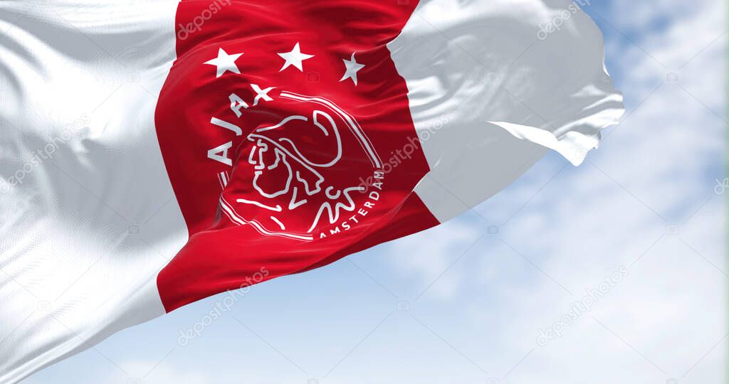Amsterdam, NED, October 2022: Close-up view of the AFC Ajax flag waving in the wind. Ajax is a Dutch football club based in Amsterdam