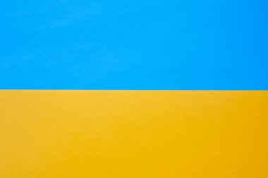Yellow and blue paper texture. Flag of Ukraine made of colored paper. Independence day blank greeting card. Mock up, copy space
