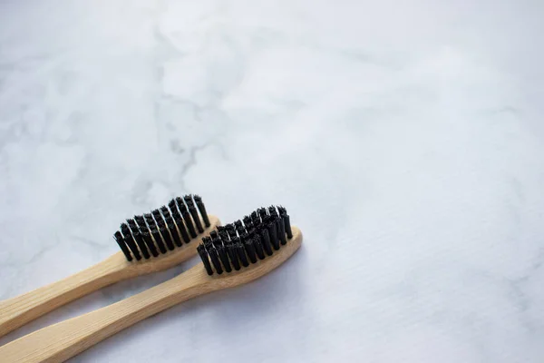 Natural Bamboo Toothbrush Black Bristles White Marble Table Bathroom Top — Stock Photo, Image
