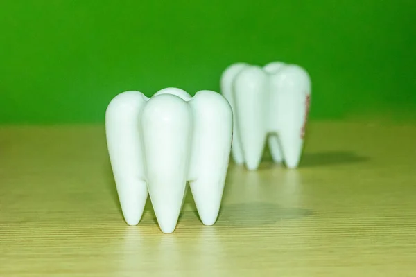 In the dental clinic and dental treatment for restoring teeth, there are two big teeth white on the dentist\'s tables. Always keep clean teeth dental health is ultimately linked to your overall health.