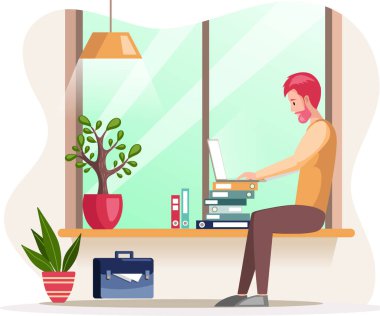 Sakallı adam, çalışan kişi masada oturuyor ve internette yazışıyor.