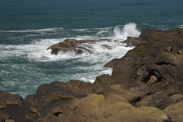 rocky cliffs at ocean water, scenic nature