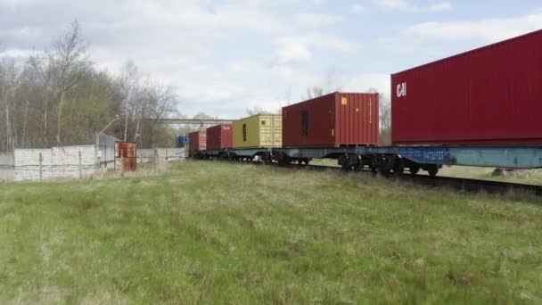 Logistics in production, aerial view of freight trains with containers, moving train, industrial landscape. — Stock Video