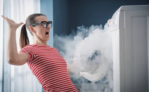 Scared Woman Dealing Broken Burning Appliance Home — Stock Photo, Image