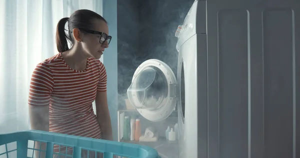 Upset Woman Staring Her Broken Washing Machine Room Full Smoke — Stock Photo, Image