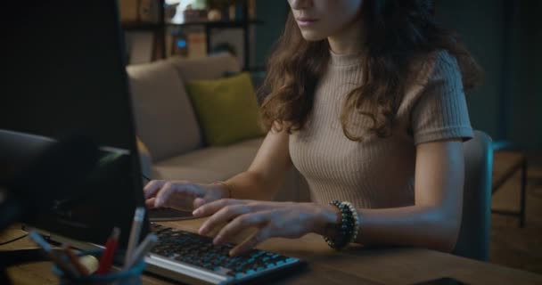 Tired woman working with computer at night — Stock Video