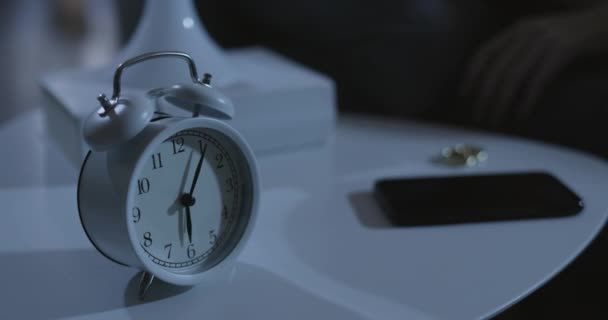 Woman turning off the alarm clock — Stock Video