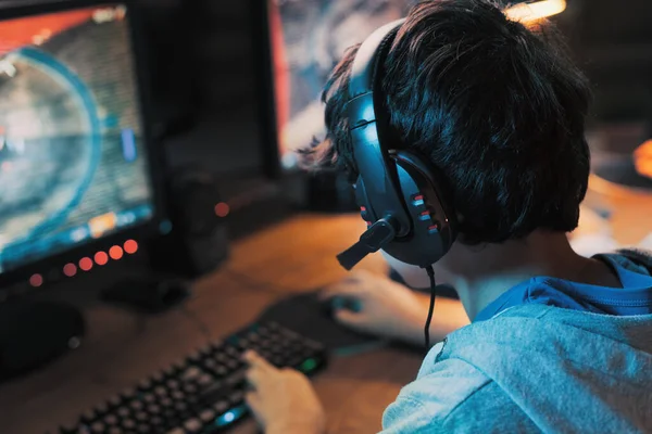 Young Gamer Wearing Headset Playing Online Multiplayer Video Games His — Stockfoto