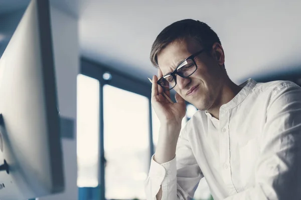 Man Sitting Desk Working His Computer Tired Has Bad Headache — стоковое фото