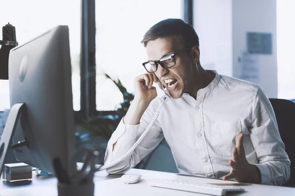 Angry Nervous Office Worker Sitting Desk Shouting Phone — Fotografie, imagine de stoc
