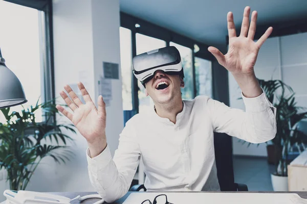 Cheerful Young Businessman Sitting Office Desk Wearing Headset Interacting Virtual — Stockfoto