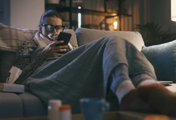 Sick Young Woman Resting Couch Home Connecting Online Using Her — Stockfoto