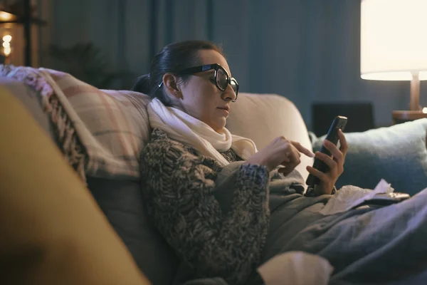 Sick Young Woman Resting Couch Home Connecting Online Using Her — ストック写真