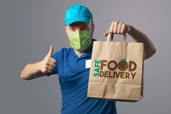 Delivery Guy Face Mask Holding Bag Fast Food Giving Thumbs — Stock Photo, Image