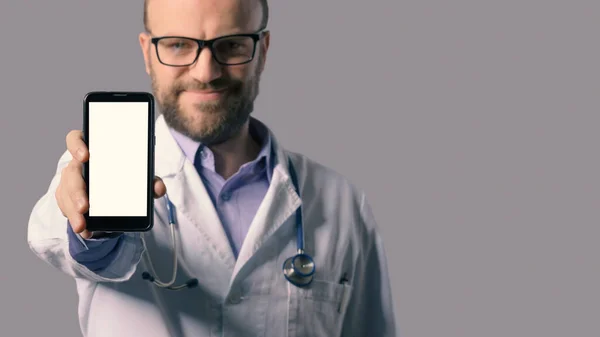 Smiling Doctor Showing Smartphone Healthcare Apps Online Doctor Concept — Zdjęcie stockowe