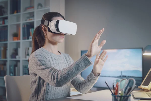 Young Woman Sitting Desk Wearing Headset She Interacting Virtual Reality — Stockfoto