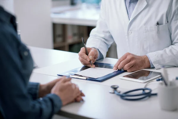 Doctor Sitting Desk His Office Writing Medical Prescription His Patient — Stock Fotó