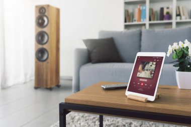 Music video playing on the tablet at home, entertainment concept