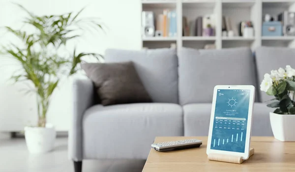 Digital Tablet Displaying Weather Forecast Living Room Table — Stok fotoğraf