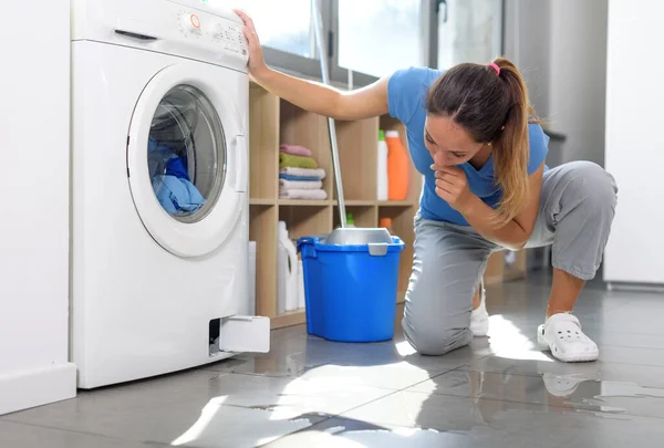 Pensive Woman Checking Water Leak Floor Washing Machine Broken — Stock Fotó