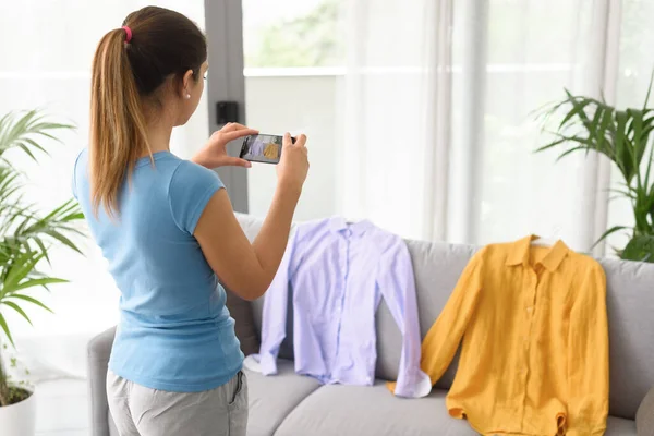 Woman Taking Picture Her Used Shirts Her Smartphone She Selling — Photo