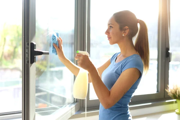 Young Woman Cleaning Windows Home She Wiping Glasses — Stock Fotó