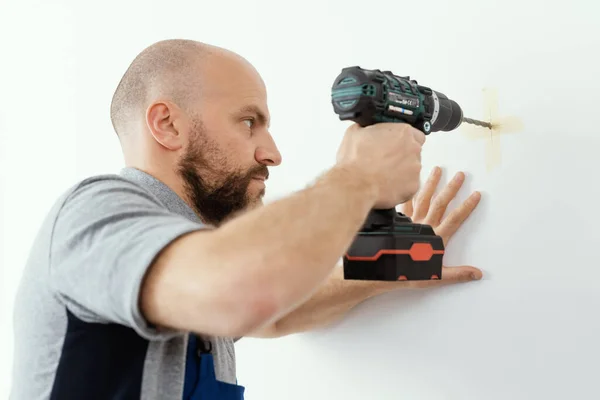 Professional Handyman Using Drill Drilling Hole Wall — Stock fotografie