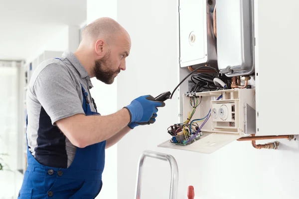 Qualified Engineer Checking Flue Gas Emissions Domestic Gas Boiler Using — Stock Photo, Image
