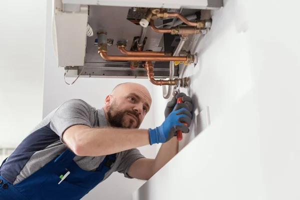 Professional Engineer Installing Natural Gas Boiler Home Checking Pipes — Fotografia de Stock