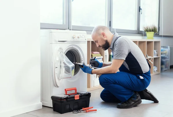 Professional Technician Writing Invoice Repairing Washing Machine Home Repair Concept — Photo