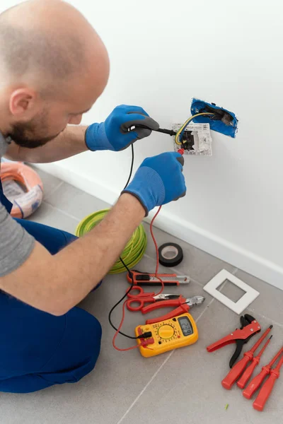 Professional Electrician Testing Outlet Using Digital Multimeter — Photo