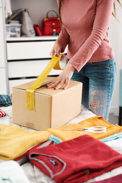Woman Preparing Delivery Box Her Used Clothes Reselling Recycling Concept — Stock Fotó