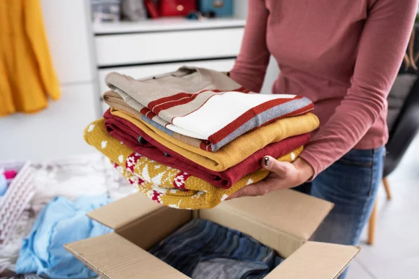 Young Woman Folding Her Clothes Packing Them Delivery Box She — Stock fotografie