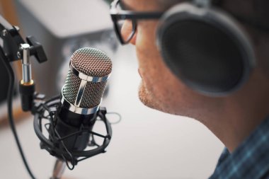 Professional speaker recording a live podcast for his channel, communication and media concept