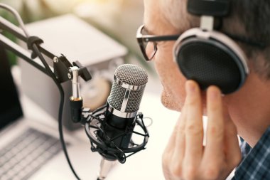 Professional speaker recording a live podcast for his channel, communication and media concept