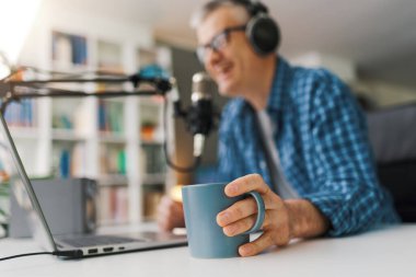 Professional speaker recording a live podcast for his channel, communication and media concept