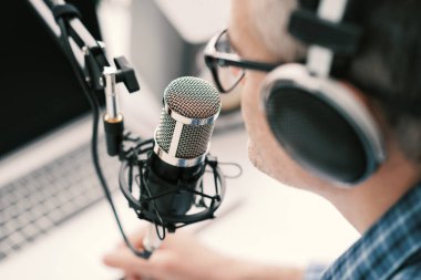 Professional speaker recording a live podcast for his channel, communication and media concept