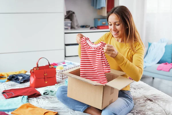 Woman Opening Delivery Box Her Bedroom She Has Received Shirt — Stock Fotó