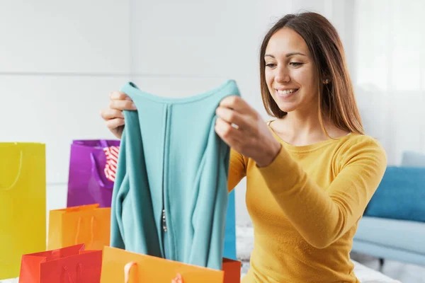 Cheerful Woman Home Looking Her New Purchases Shopping Fashion Concept —  Fotos de Stock