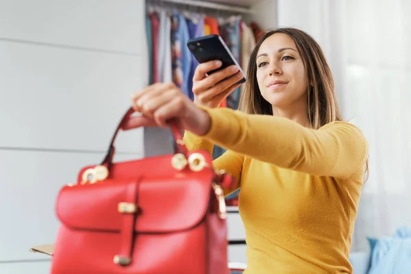 Young Woman Taking Picture Her Bag Bedroom She Selling Her — Foto Stock